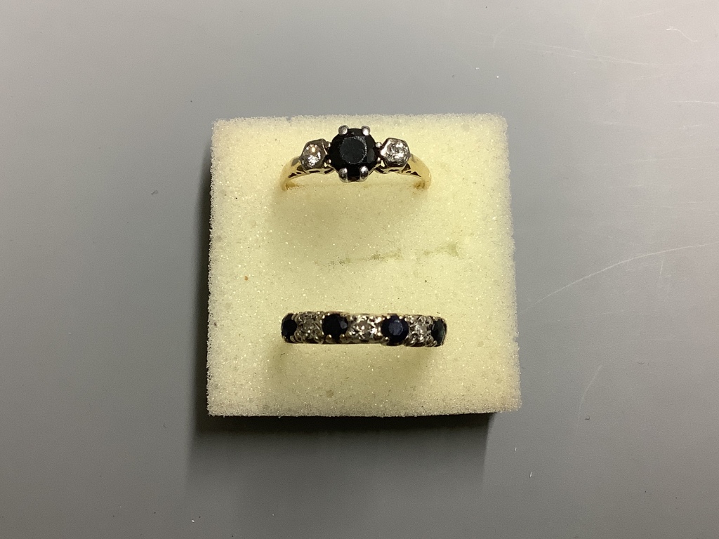 Two yellow metal, sapphire and diamond rings